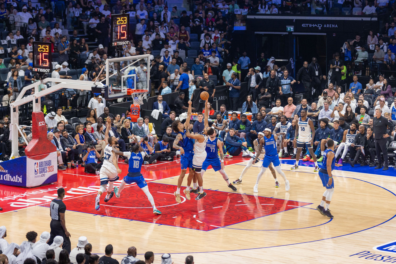 Live action shot from Abu Dhabi NBA Games 2023 at Etihad Arena with crowd cheering in the background